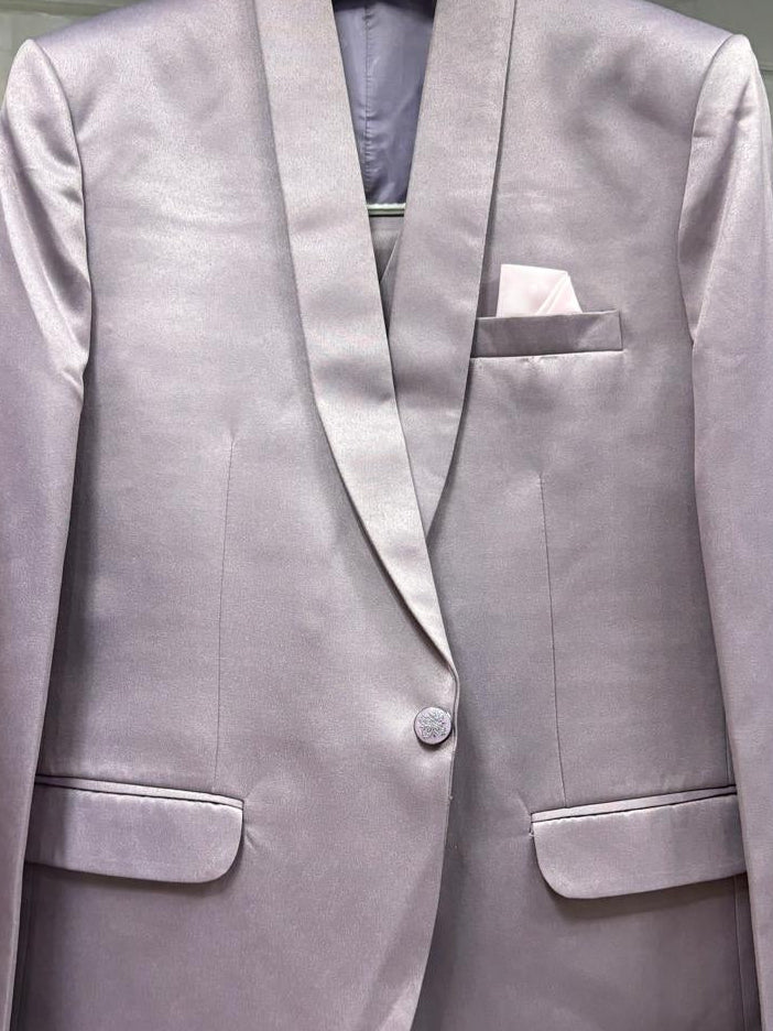 A light lavender satin blazer with notched lapels, a single button closure, flap pockets, and a matching pocket square, displayed on a hanger.