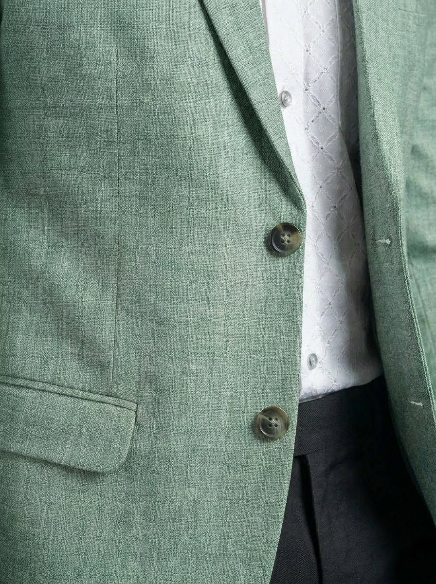 Green knitted blazer fabric detail