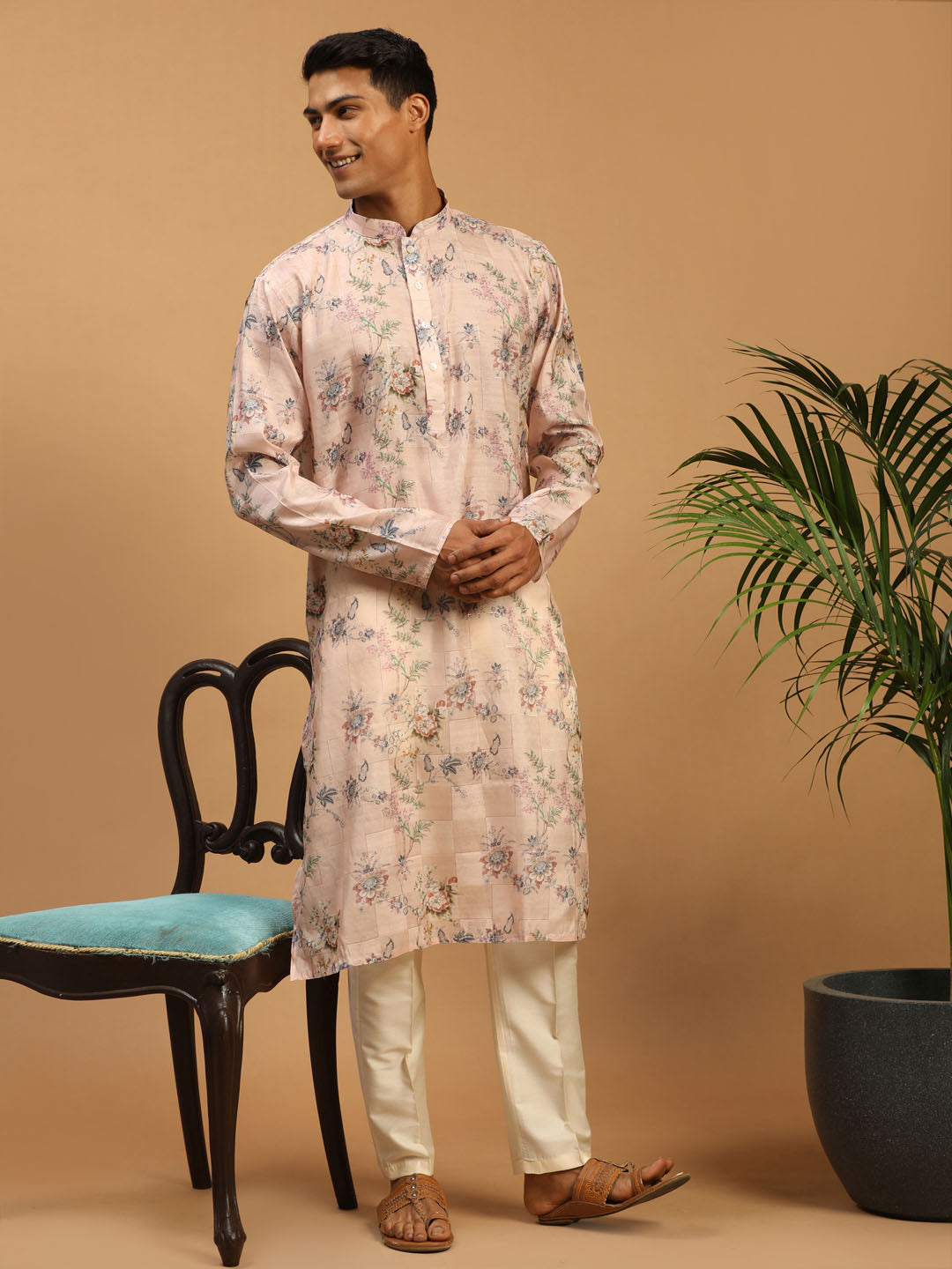Men wearing pink floral kurta pant set